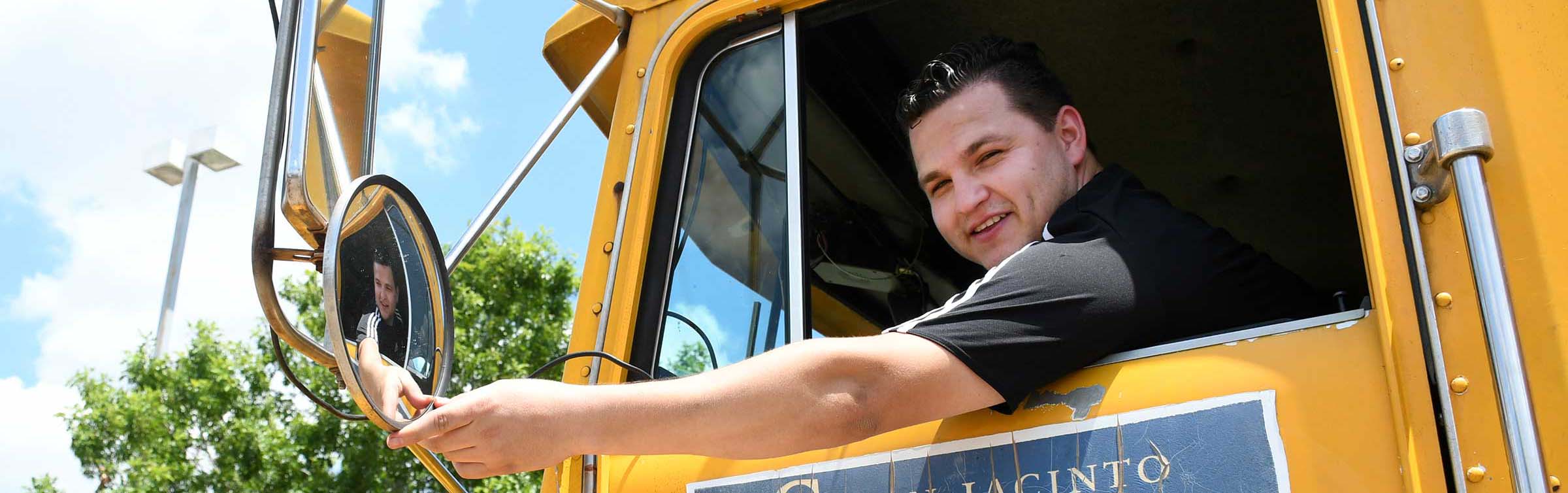 Truck Driving student in big rig cab