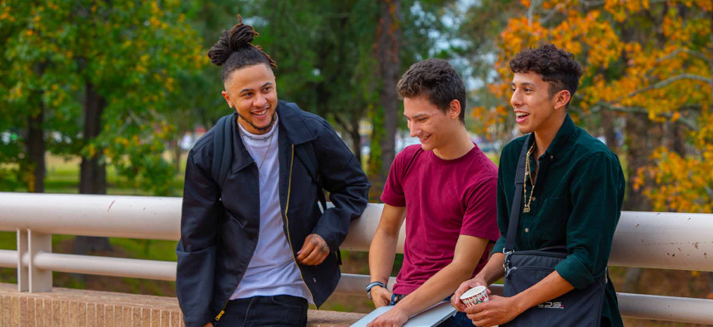 male students smiling and talking to each other while getting to attend san jacinto college thanks to scholarships and donors who fund aid