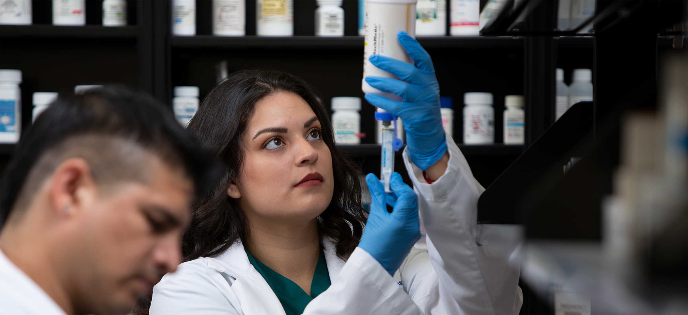 Pharmacy Technician student with syringe