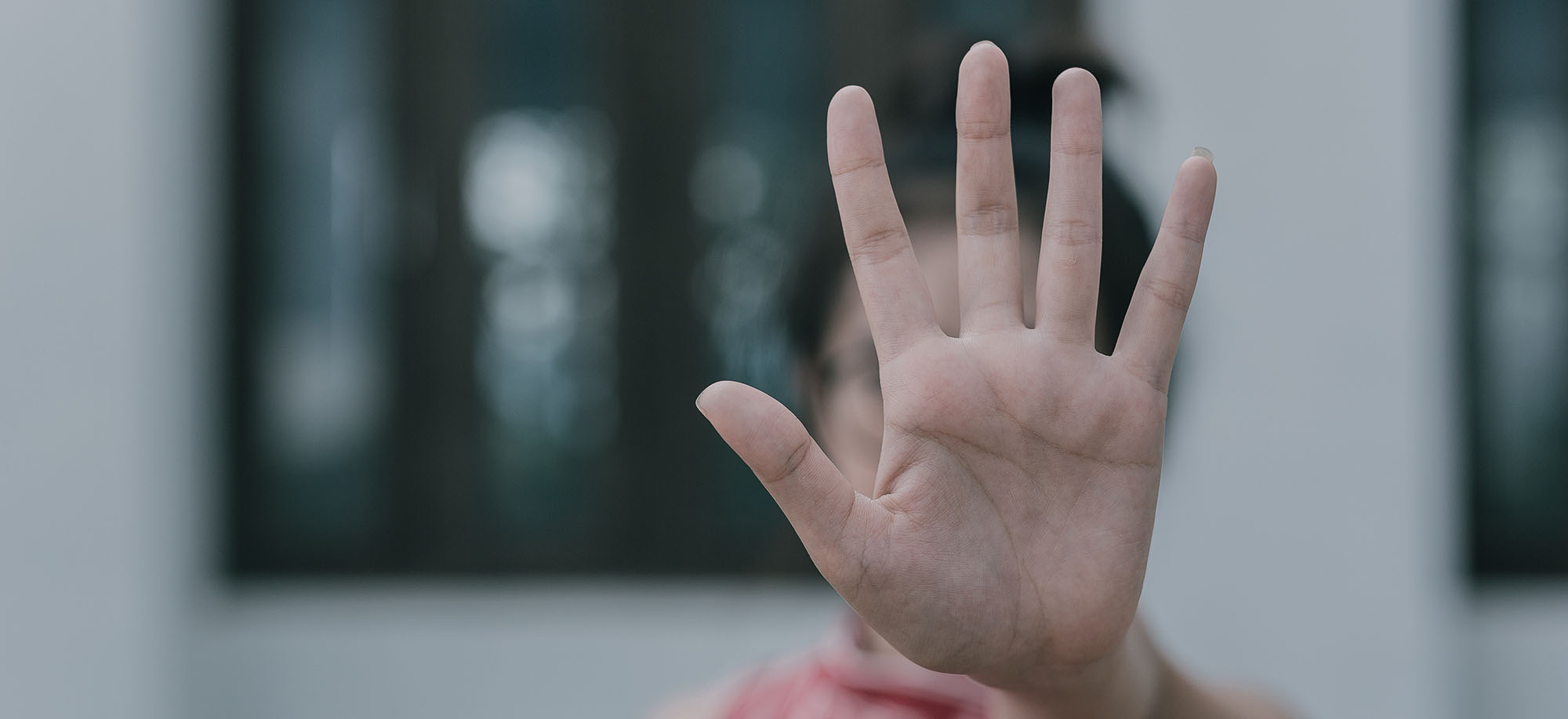 woman putting hand up to stop