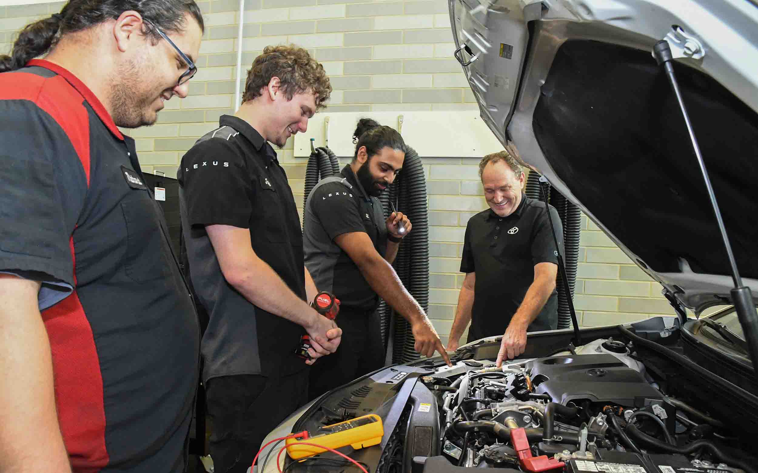 T-TEN students work on a vehicle
